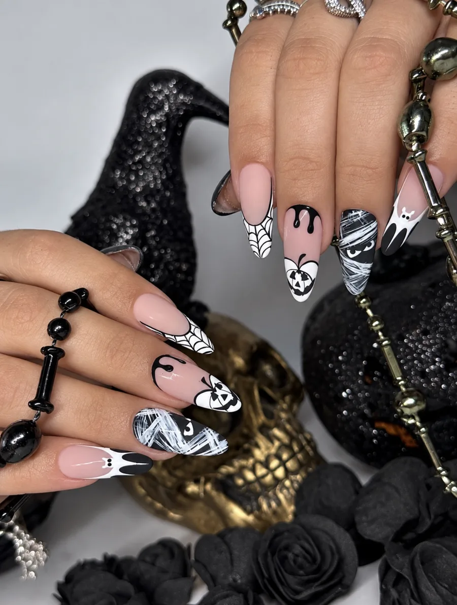 Halloween pumpkin and ghost nail art